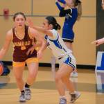 Thunder Mountain senior Jaya Carandang defends Dimond senior Maile Wilcox (5) during the Falcons 58-47 win over the Lynx in the 2024 ASAA March Madness Alaska 4A Girls Basketball State Championships on Wednesday at Anchorages Alaska Airlines Center. (Klas Stolpe / For the Juneau Empire)