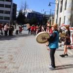 Participants in a climate rally gather in front of the Alaska State Capitol on Thursday. The event received a permit from the City and Borough of Juneau allowing the street to be closed to vehicle traffic for 90 minutes, although some participants used the gathering to denounce a bill by Gov. Dunleavy to limit unauthorized public demonstrations. (Mark Sabbatini / Juneau Empire)