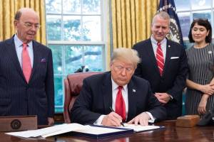 U.S. Sen. Dan Sullivan, R-Alaska, second from right, attends a bill signing by President Donald Trump on Thursday, Oct. 11, 2018, in the Oval Office of the White House. (Official White House photo)