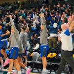 Thunder Mountain celebrates their 48-45 overtime win against the Service Cougars in a semifinal at the 2024 ASAA March Madness Alaska 4A Boys Basketball State Championships on Friday at Anchorages Alaska Airlines Center. The Falcons will play East Anchorage for the state championship Saturday. (Klas Stolpe / For the Juneau Empire)