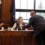 Rep. DeLena Johnson, R-Palmer, center, discusses budget legislation with her chief of staff, Remond Henderson, standing, and Reps. Neil Foster, D-Nome, left, and Bryce Edgmon, I-Dillingham on March 20, 2023. (Mark Sabbatini / Juneau Empire file photo)