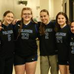 Thunder Mountain High School seniors Mikah Carandang (4), Jenna Dobson (5), Kara Strong (33), Ashlyn Gates (2), Kairdree Hartman (24) and Jaya Carandang (3) pose for a photo outside their locker room after the Falcons final game of the 2024 ASAA March Madness Alaska 4A Girls Basketball State Championships on Saturday at Anchorages Alaska Airlines Center. (Klas Stolpe / For the Juneau Empire)