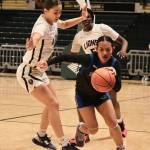 Thunder Mountain High School senior Mikah Carandang (4) dribbles through a half court press by Mountain City seniors Morgan Maldonado and Nyamach Mathot during the Falcons 52-37 loss to the Lions in the 3rd/5th place game of the 2024 ASAA March Madness Alaska 4A Girls Basketball State Championships on Saturday at Anchorages Alaska Airlines Center. (Klas Stolpe / For the Juneau Empire)