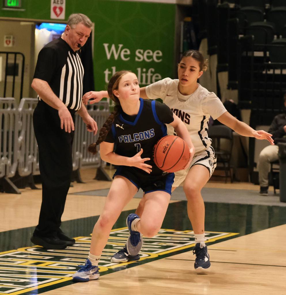 Thunder Mountain High School sophomore Cambry Lockhart drives the baseline during the Falcons 52-37 loss to the Lions in the 3rd/5th-place game of the 2024 ASAA March Madness Alaska 4A Girls Basketball State Championships on Saturday at Anchorages Alaska Airlines Center. (Klas Stolpe / For the Juneau Empire)