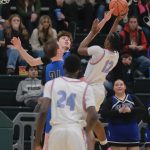 Thunder Mountain senior Kasen Ludeman blocks a shot by East senior Akeem Sulaiman (12) as Falcons teammate James Polask moves in during the Falcons 60-34 loss to the Thunderbirds in the title game of the 2024 ASAA March Madness Alaska 4A Boys Basketball State Championships on Saturday at Anchorages Alaska Airlines Center. (Klas Stolpe / For the Juneau Empire)