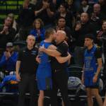 Thunder Mountain coach John Blasco hugs senior Thomas Baxter (33) after subbing him out at the end of the Falcons 60-34 loss to the Thunderbirds in the title game of the 2024 ASAA March Madness Alaska 4A Boys Basketball State Championships on Saturday at Anchorages Alaska Airlines Center. (Klas Stolpe / For the Juneau Empire)