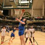 Thunder Mountain senior James Polasky (24) scores past East Anchorage junior Jal Tharjiath (32) during the Falcons 60-34 loss to the Thunderbirds in the title game of the 2024 ASAA March Madness Alaska 4A Boys Basketball State Championships on Saturday at Anchorages Alaska Airlines Center. (Klas Stolpe / For the Juneau Empire)