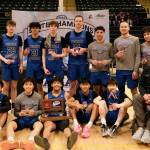 The Thunder Mountain Falcons boys basketball team poses with their runner-up trophy after falling to East Anchorage 60-34 in the title game of the 2024 ASAA March Madness Alaska 4A Boys Basketball State Championship game on Saturday at Anchorages Alaska Airlines Center. (Klas Stolpe / For the Juneau Empire)