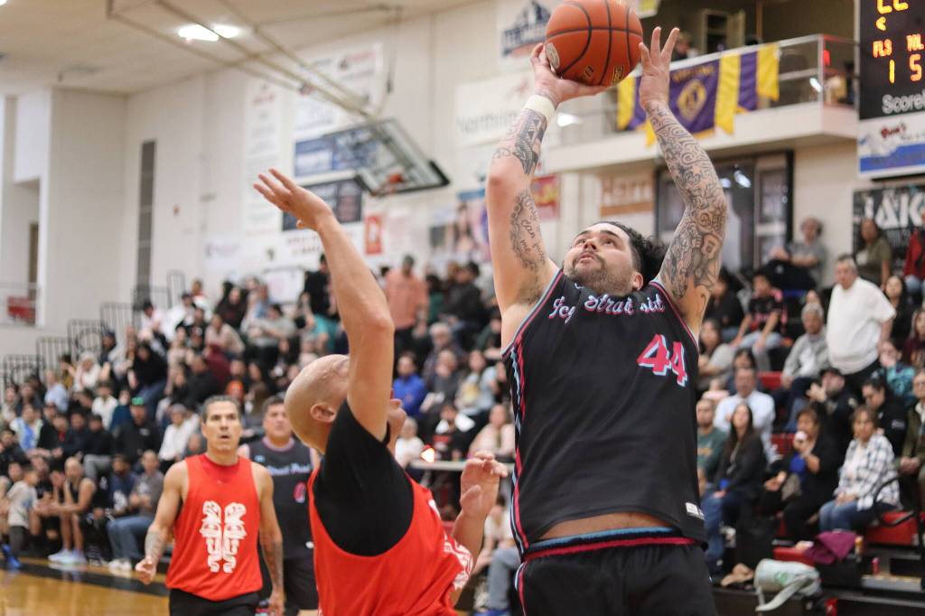 Hoonahs Jon Torres takes a shot against Hydaburg during the C Bracket championship game at the 75th Gold Medal Basketball Tournament on Saturday at Juneau-Douglas High School: Yadaa.at Kalé. (Mark Sabbatini / Juneau Empire)