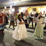 Nimmy Philips (center), owner of Spice Juneau Indian Cuisine, leads a Bollywood dance flash mob during a Holi celebration Monday night in downtown Juneau. (Mark Sabbatini / Juneau Empire)