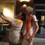 Dara Lohnes-Davies and Philip Davies take a selfie following the throwing of colors at the Holi festival in downtown Juneau on Monday night. (Mark Sabbatini / Juneau Empire)