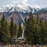 A towering Lutz spruce, center, in the Chugach National Forest is about to be hoisted by a crane Tuesday, Oct. 27, 2015, for transport to the West Lawn of Capitol Hill in Washington, D.C., to be the 2015 U.S. Capitol Christmas Tree. (Photo courtesy of the U.S. Forest Service)