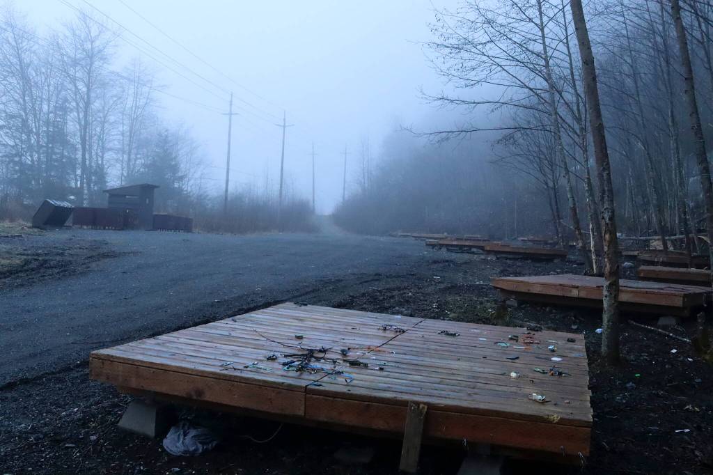 Scattered debris remains on a tent platform at Mill Campground on Wednesday, where people experiencing homelessness have stayed the past two summers. (Mark Sabbatini / Juneau Empire)