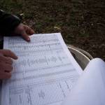Eric Cordingley looks at his records while searching for the graves of those who died at Morningside Hospital at Multnomah Park Cemetery on Wednesday, March 13, 2024, in Portland, Ore. Cordingley has volunteered at his neighborhood cemetery for about 15 years. Hes done everything from cleaning headstones to trying to decipher obscure burial records. He has documented Portland burial sites  Multnomah Park and Greenwood Hills cemeteries  have the most Lost Alaskans, and obtained about 1,200 death certificates. (AP Photo/Jenny Kane)