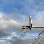 An outdoor basketball hoop is seen in Bethel in October 2022. A bill advanced in the House Education Committee on Wednesday would expand limitations for trans girls on sports teams. (Claire Stremple / Alaska Beacon)