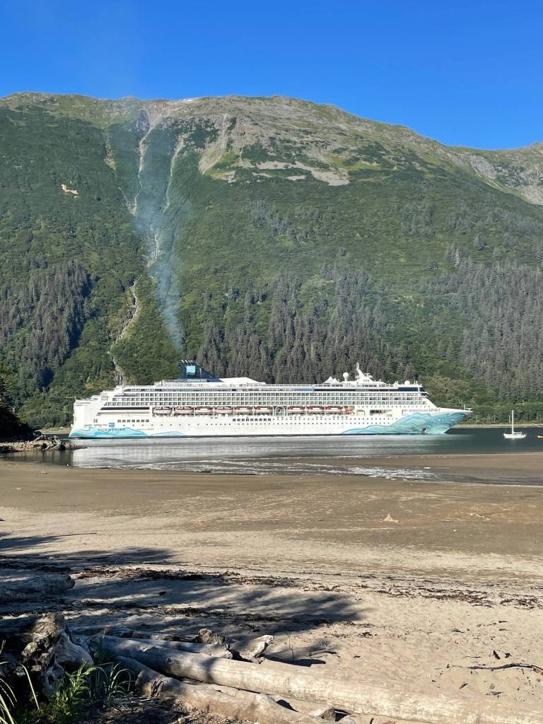 Emissions from a cruise ship are seen from Sandy Beach on Aug. 27, 2023. A Cruise Line Industry Association official said the organization has set a net-zero carbon goal by 2050. (Photo by Laurie Craig)