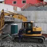 Construction workers work Tuesday at the site where the historic Elks Lodge stood until it was demolished last year. The area as well as adjacent property will be used for an expansion of a food court that has operated from May to September for several years. (Mark Sabbatini / Juneau Empire)