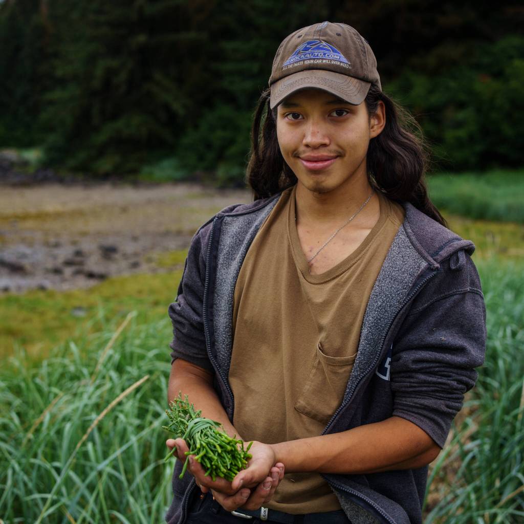 Ted Elliott harvests beach asparagus for community distribution as a participant in the Alaska Youth Stewards program, Today he works with the Hoonah Native Forest Partnership with the Hoonah Indian Association. (Photo by Bethany Sonsini Goodrich)