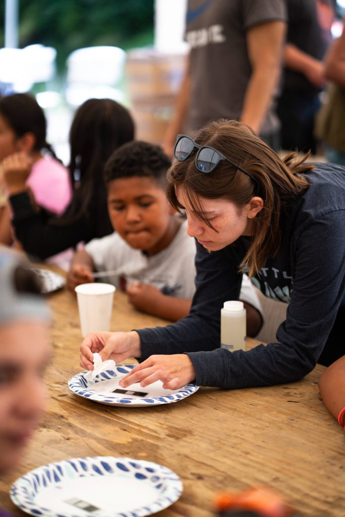 Kalia Davis returns to Kake to teach local youth how to prepare microscope slides during a summer workshop. (Photo by Bethany Sonsini Goodrich)