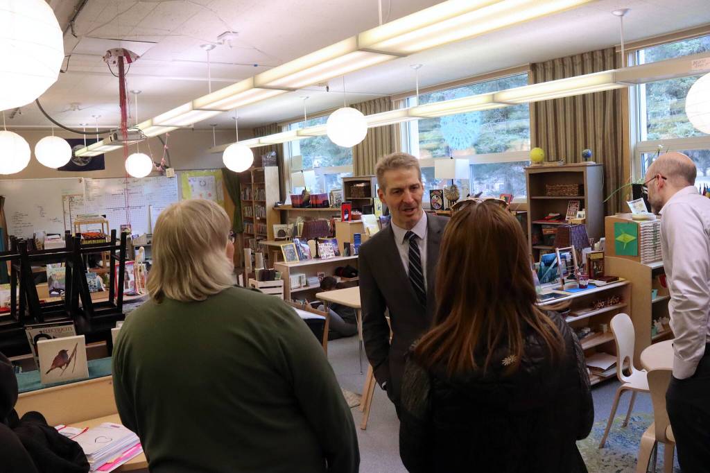 Juneau School District Superintendent Frank Hauser explains facilities in the library at Marie Drake Building during a tour on Thursday, April 4. (Mark Sabbatini / Juneau Empire)