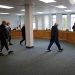 Juneau Assembly members and other visitors examine a meeting room formerly used by the nine-member Alaska State Board of Education and Early Development on Monday, April 8, which is about 25% larger than the Assembly Chambers at City Hall. (Mark Sabbatini / Juneau Empire)