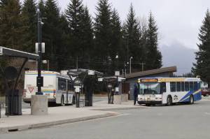Capital Transit buses stop at the Valley Transit Center on Thursday. Two bus routes serving areas of the Mendenhall Valley and near the airport will temporarily be discontinued starting April 22 due to lack of staff. (Mark Sabbatini / Juneau Empire)