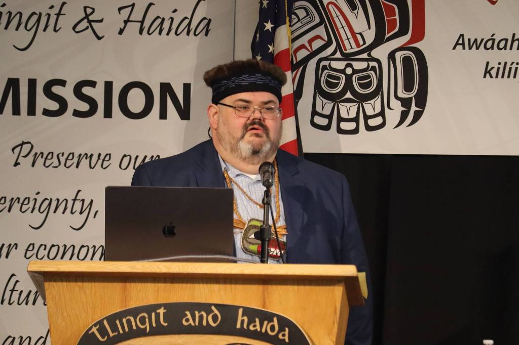 Tlingit and Haida President Richard Chalyee Éesh Peterson delivers his State of the Tribe speech to delegates during the opening of the 89th annual Tribal Assembly on Wednesday morning at Elizabeth Peratrovich Hall. (Mark Sabbatini / Juneau Empire)