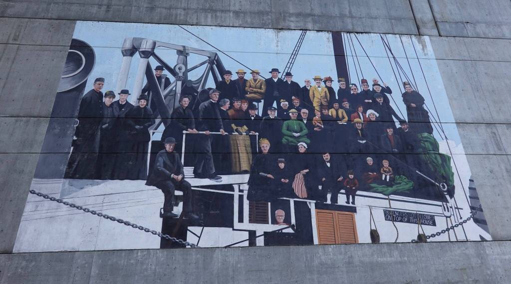 The 1986 mural ANCON is based on a historical photo of early steamship passengers, but features faces of 1980s living descendants of white pioneers. (Laurie Craig / For the Juneau Empire)