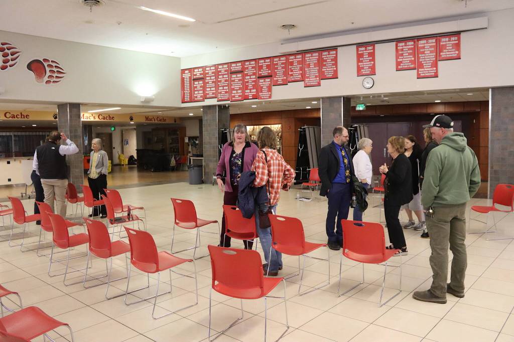 Juneaus three legislators talk to attendees following a town hall on Thursday evening at Juneau-Douglas High School: Yadaa.at Kalé. (Mark Sabbatini / Juneau Empire)