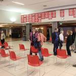 Rep. Andi Story (left, wearing gray), Rep. Sara Hannan (center, wearing purple) and Sen. Jesse Kiehl (wearing suit) talk with constituents following a legislative town hall on Thursday at Juneau-Douglas High School: Yadaa.at Kalé. (Mark Sabbatini / Juneau Empire)