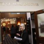 Rep. Andi Story, a Juneau Democrat, greets a legislative page on her way into the House chambers for the opening day of this years session on Tuesday, Jan. 16. (Mark Sabbatini / Juneau Empire file photo)