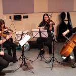 Frank Felkl, Maya Breedlove, Meg Rosson and Meghan Johnson perform string quartet music during the Empty Bowls fundraiser on behalf of the Glory Hall at Centennial Hall on Sunday. (Mark Sabbatini / Juneau Empire)