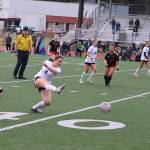 Clairee Overson (#8) kicks the ball downfield for Thunder Mountain High School during Mondays game against Juneau-Douglas High School: Yadaa.at Kalé at Adair-Kennedy Field. (Mark Sabbatini / Juneau Empire)