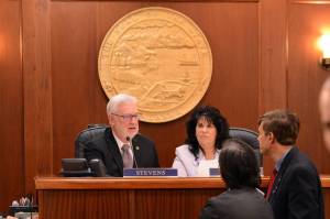 Senate President Gary Stevens, R-Kodiak, and Speaker of the House Cathy Tilton, R-Wasilla, speak to legislators during a break in the March 12 joint session of the Alaska House and Senate. (James Brooks/Alaska Beacon)