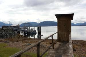 An aging outhouse on the pier extending out from the fire station thats purportedly the only public toilet in Tenakee Springs in August of 2022. (Mark Sabbatini / Juneau Empire file photo)