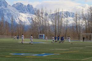 The Juneau-Douglas High School: Yadaa.at Kalé boys soccer team takes on Palmer High School on Friday in Anchorage. (Photo by Tory Bennetsen)