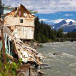 Debris from a home that partially fell into the Mendenhall River sits on its banks on Sunday, Aug. 6, 2023, after record flooding eroded the bank the day before. (Mark Sabbatini/Juneau Empire file photo)