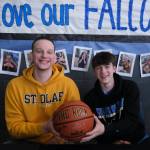 Thunder Mountain High School seniors James Polasky, left, and Samuel Lockhart, right, signed letters of intent on Thursday in the TMHS commons to play college basketball. Polasky will attend St. Olaf in Minnesota and Lockhart will attend Edmonds College in Washington state. (Klas Stolpe / For the Juneau Empire)