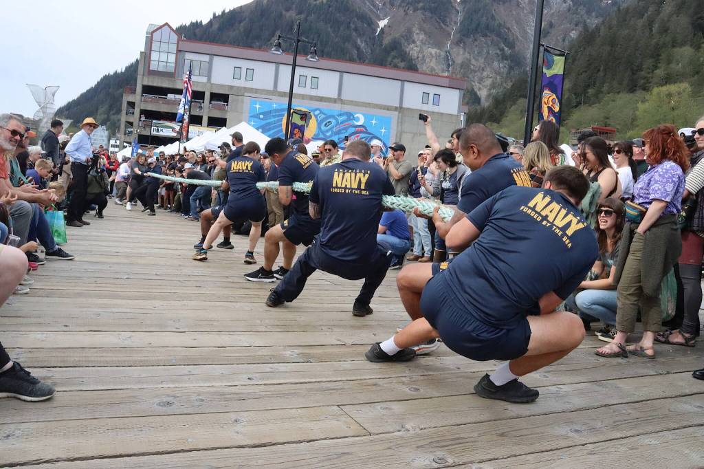 U.S. Navy personnel assigned to the USS William P. Lawrence destroyer battle local member of the U.S. Coast Guard during the tug-of-war contest at the annual Juneau Maritime Festival at Elizabeth Peratrovich Plaza on Saturday. (Mark Sabbatini / Juneau Empire)