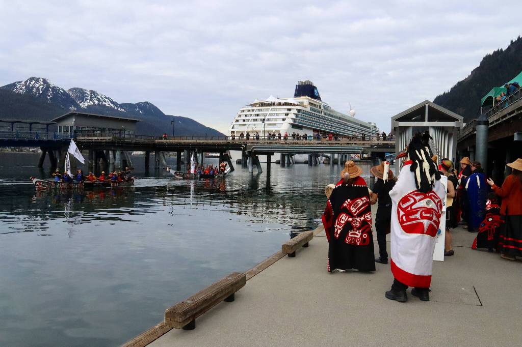 The Yees Ku Oo Dancers welcome two canoes paddled by members of the One People Canoe Society as they near their landing spot during the annual Juneau Maritime Festival at Elizabeth Peratrovich Plaza on Saturday.(Mark Sabbatini / Juneau Empire)