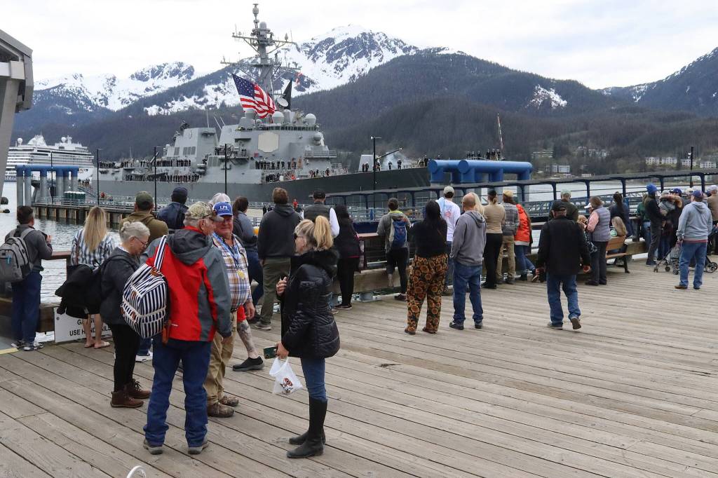 People watch the arrival of the USS William P. Lawrence, a U.S. Navy destroyer, on Saturday afternoon. It is the first time a military vessel has arrived during the Juneau Maritime Festival. (Mark Sabbatini / Juneau Empire)