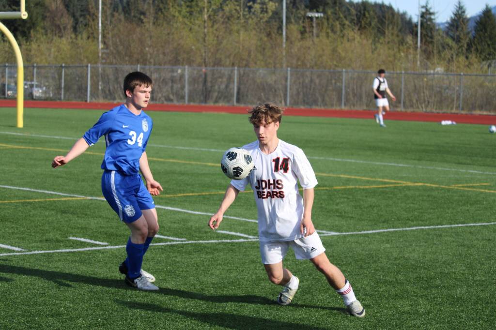 Juneau Douglas High School: Yadaa.at Kalés Kai Ciambor tries to keep control of the ball against Thunder Mountain High Schools Ethan Van Kirk during Thursdays game at TMHS. (Photo by Tory Bennetsen)