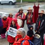 Red clothing is worn and displayed as a sign of a unified call for action during a rally in front of the Alaska State Capitol on Sunday to commemorate the annual Missing and Murdered Indigenous Persons Awareness Day. (Mark Sabbatini / Juneau Empire)