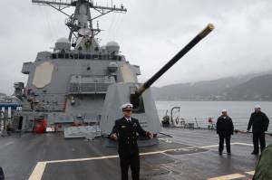 Lt. Daniel Schuerman, the ships operations officer, shows the 5-inch/54-caliber Mark 45 gun on the foredeck of the USS William P. Lawrence during a tour Sunday in Juneau. (Mark Sabbatini / Juneau Empire)