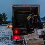 With snow steadily falling and daylight fading, career fair participants pitched in with a final task for Angoon. Earlier in the season, the boys basketball team had split firewood as a fundraiser. Wood stoves heat many of the older homes in Angoon. They are a reprieve from high electricity and fuel prices, but only as long as a household can chop and move their own firewood  making the deliveries a lifeline for elders and their families. Participants help load and deliver firewood to elders and families in need. (Photo by Jenny Starrs)