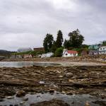 Like many remote communities in Alaska, Angoon runs on diesel at a cost of about $0.50 per kilowatt-hour. The states Power Cost Equalization program brings down residential electricity rates to $0.39/kWh  still double the rates in many nearby communities  but it doesnt apply to businesses or facilities like the school or clinic. Without affordable local electricity generation, Angoons energy security and economic opportunity has suffered from a reliance on the fluctuating prices of yearly fuel deliveries. Angoons energy economy is on the precipice of big changes, however. Kootznoowoo Inc., Angoons Alaska Native Village Corporation, was awarded $26.9 million in February 2024 to build a run-of-river hydroelectric facility and transmission line at Thayer Creek, or Watkesate. (Photo by Lee House)