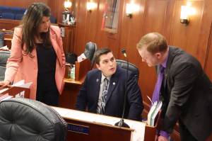 Mark Sabbatini / Juneau Empire
Rep. Jamie Allard, R-Eagle River, Rep. Justin Ruffridge, R-Soldotna, and Rep. David Eastman, R-Wasilla, discuss an amendment to a bill restricting transgender participation in school sports during a House floor session Thursday.