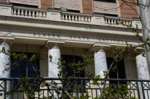 Budding trees and bushes are seen in front of the Alaska State Capitol on Wednesday, May 1. (James Brooks/Alaska Beacon)