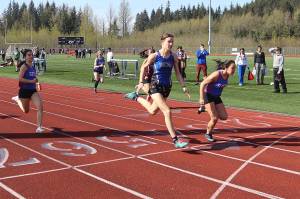 A photo finish in the 100-meter dash sees Sitka High Schools Adalyna Moore (right) finish ahead of Thunder Mountain High Schools Kerra Baxter  although both were officially clocked at 13.54 seconds  during the Capital Invitational Track and Field Meet on Saturday at TMHS. (Mark Sabbatini / Juneau Empire)