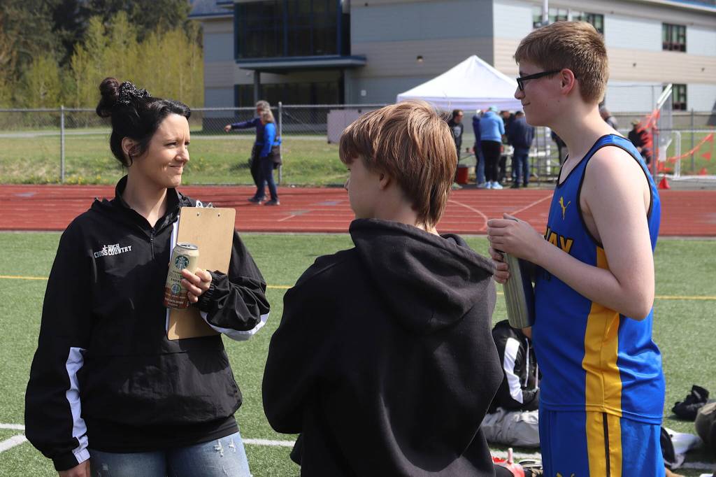 Skagway High School freshman Samuel Munson (right) talks with his coach Kortney Rupprecht after completing the 1,600-meter race during the Capital Invitational Track and Field Meet on Saturday at Thunder Mountain High School. (Mark Sabbatini / Juneau Empire)